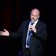 Image for article titled Louis CK Performed in Front of a Big Sign That Said 'SORRY,' Still Isn't Sorry
